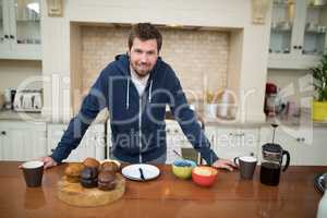 Man preparing muffins in the kitchen