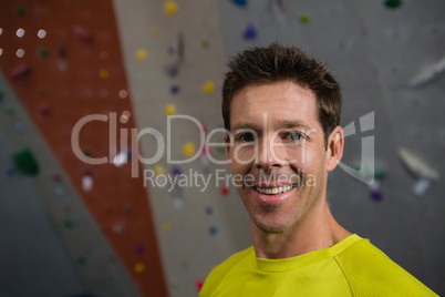 Portrait of confident athlete standing in health club