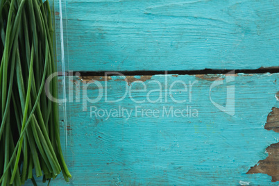 Garlic chives in plastic container