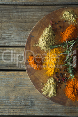 Various type of spices in plate on board