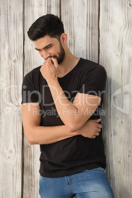 Thoughtful man posing with arms crossed