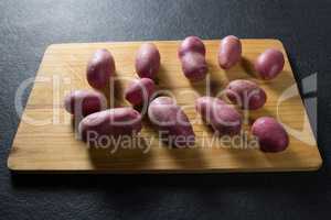 High angle view of sweet potatoes on cutting board