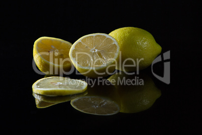 Fresh lemon on black background