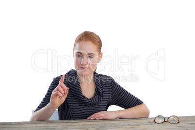 Smiling businesswoman using invisible screen