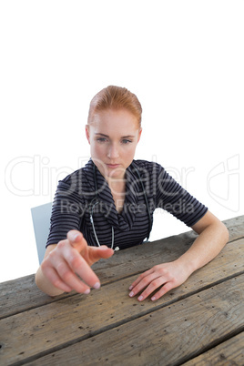 Female doctor touching imaginary interface at table