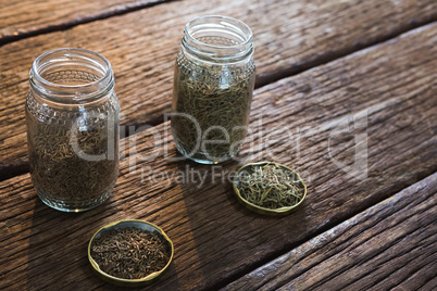 Spices in a jar on wooden table