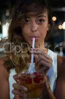 Portrait of beautiful woman having drink