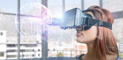 Composite image of close up of young woman using virtual reality simulator
