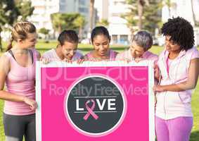 Love icon and pink breast cancer awareness women holding card