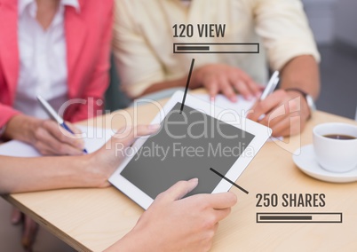 People on tablet with Views and Shares status bars at meeting