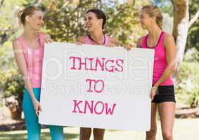 Things to know text and pink breast cancer awareness women holding card