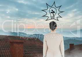 Light bulb and Businesswoman standing on Roofs with chimney and misty colorful landscape