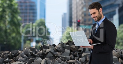 Broken concrete rubble  and businessman in cityscape