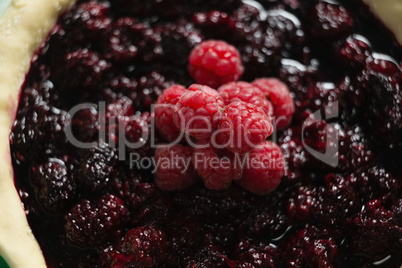 Raspberries and blackberries on tart