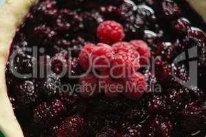Raspberries and blackberries on tart