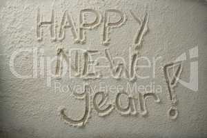 Overhead view of happy new year text on flour