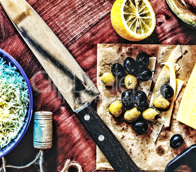 Wine snacks.  Olives, cheese, avocado, lemon