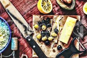 Wine snacks.  Olives, cheese, avocado, lemon