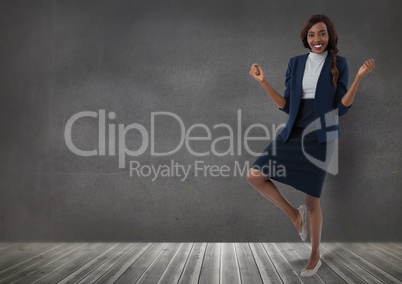 Businesswoman standing on one leg in room