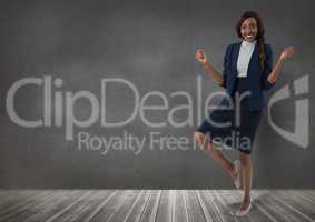 Businesswoman standing on one leg in room