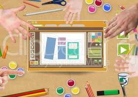 Hands touching Design editor window and creative art objects on Paper cut out desktop
