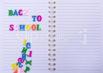 inscription back to school on a white notebook