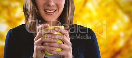 Composite image of portrait of woman holding coffee cup