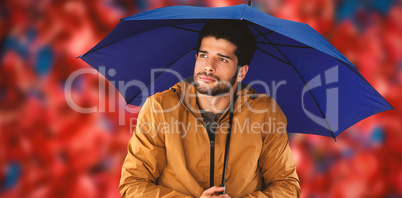 Composite image of thoughtful man standing with umbrella