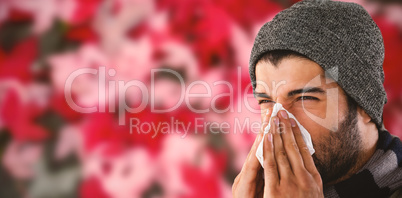 Composite image of close-up of man blowing nose with tissue paper
