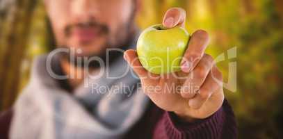 Composite image of man holding apple