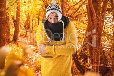 Composite image of portrait of man feeling cold