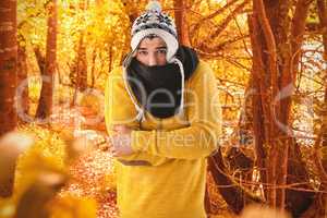 Composite image of portrait of man feeling cold