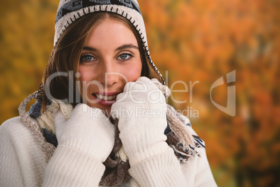Composite image of close up portrait of smiling young woman in sweater