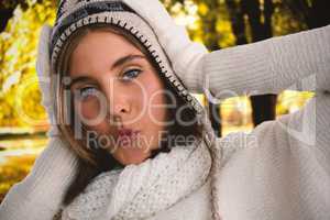 Composite image of close-up portrait of woman in knit hat