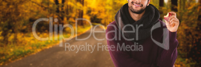 Composite image of portrait of young man holding apple