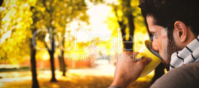 Composite image of thoughtful man having coffee