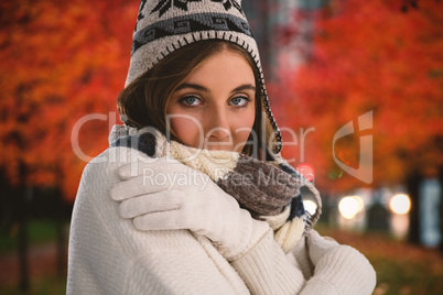 Composite image of portrait of young woman in sweater