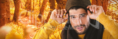 Composite image of man posing against black background
