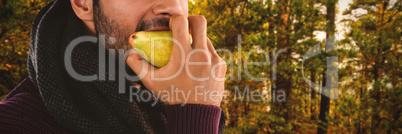 Composite image of young man eating pear