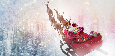 Composite image of high angle view of santa claus riding on sled with gift box