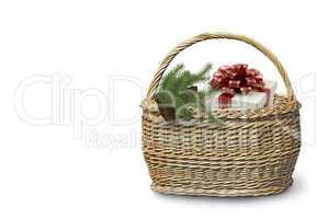 Wicker basket with gifts on a white background.