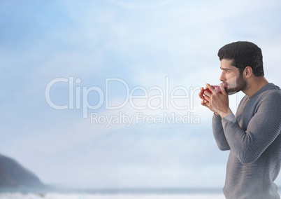 Man with cup and sea