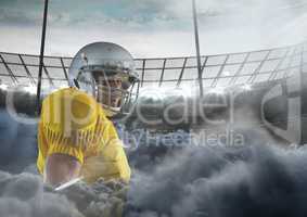 american football player in stadium with smoke