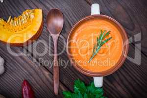 creamy pumpkin soup in a ceramic plate