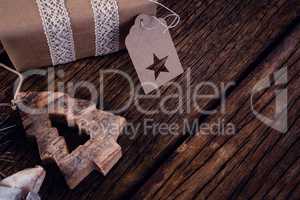 Gift boxes and christmas decoration on wooden plank