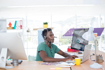 Executive working on laptop in office