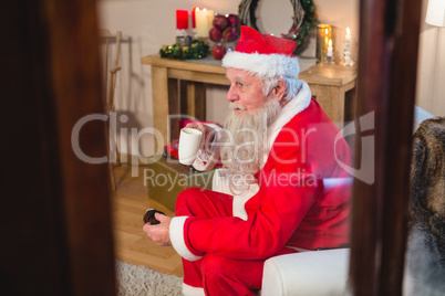 Santa Claus sitting and having coffee