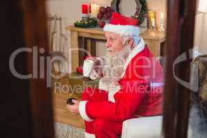 Santa Claus sitting and having coffee