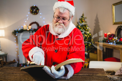 Santa Claus reading book