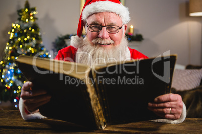Santa Claus reading book